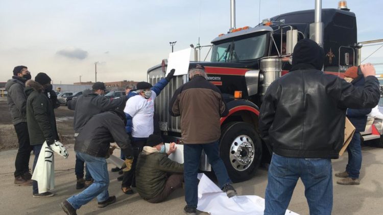 Light armoured vehicles manufactured by General Dynamics Land Systems, in London, Ontario, are being transported to port by Paddock Transport International, where they are loaded onto Saudi ships